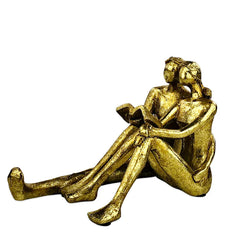 Golden Couple Reading Book Sculpture